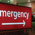 red emergency sign with arrow pointing right in white