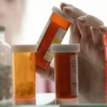 three medication bottles