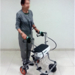 patient using specialized walker DME